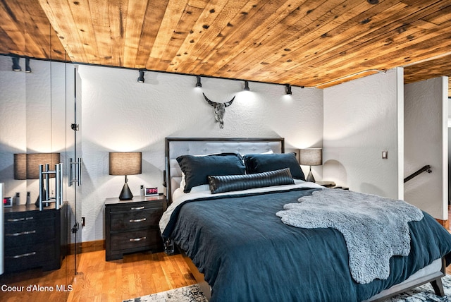 1715 Sherman Ave, Coeur Dalene, ID 83814 - bedroom featuring track lighting, wood ceiling, and light hardwood / wood-style floors
