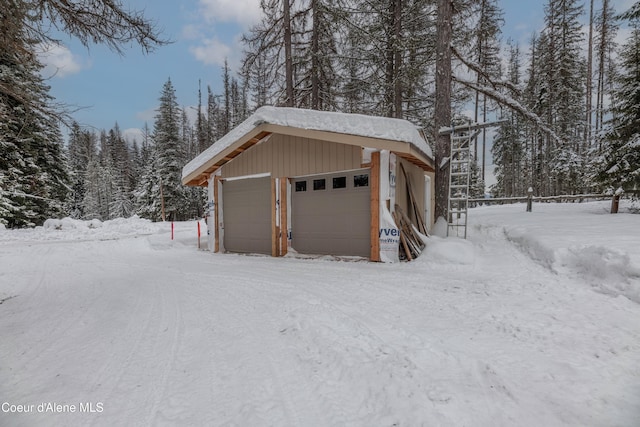 view of snow covered garage