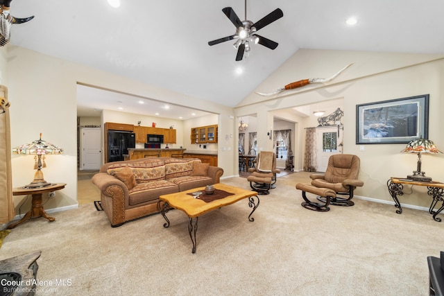 living room featuring light carpet, ceiling fan, and baseboards