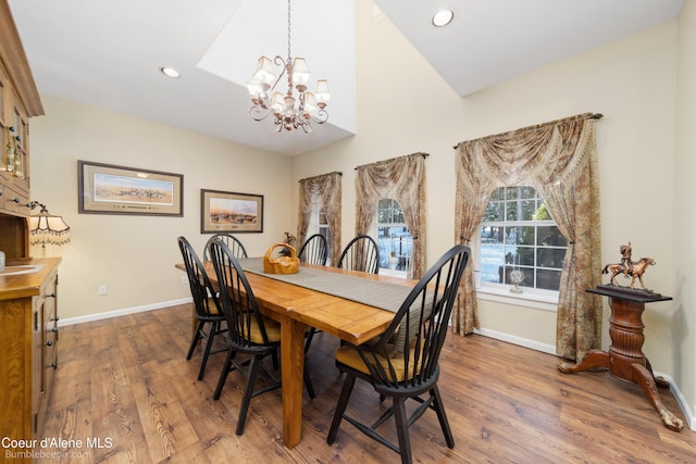 dining room featuring baseboards, a chandelier, wood finished floors, and recessed lighting