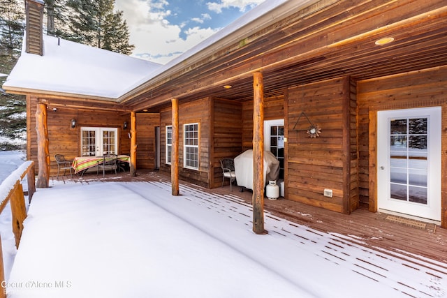 exterior space featuring french doors and a wooden deck