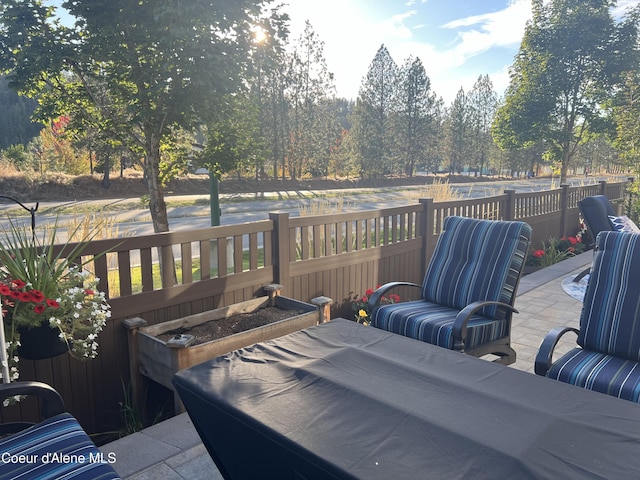 wooden terrace with a patio