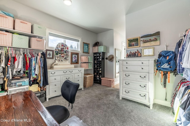 office space featuring light carpet and baseboards