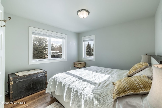 bedroom with wood finished floors