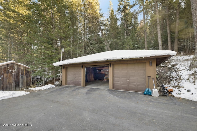 view of snow covered garage