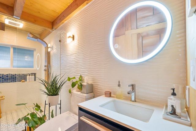 bathroom featuring beamed ceiling, vanity, wood ceiling, and toilet