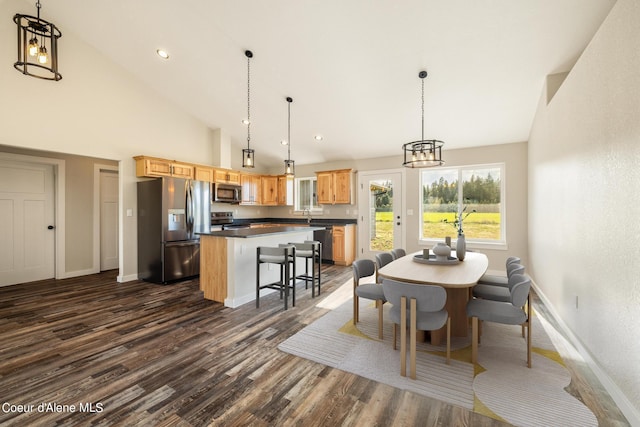 dining room featuring high vaulted ceiling, dark wood-style flooring, recessed lighting, and baseboards