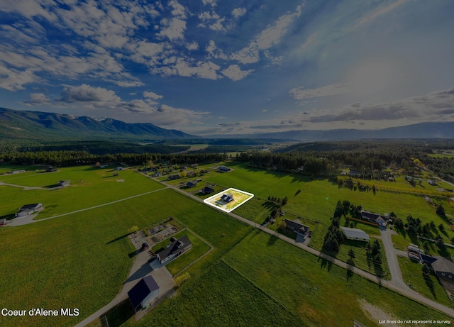 bird's eye view featuring a rural view and a mountain view