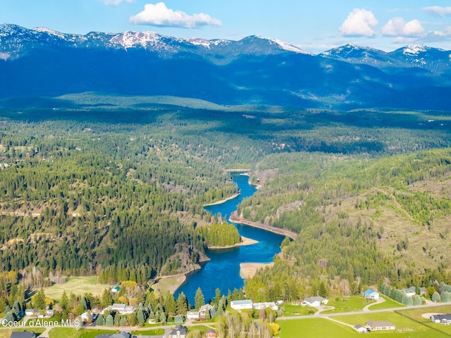 bird's eye view with a water and mountain view