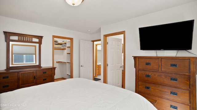 bedroom featuring a walk in closet