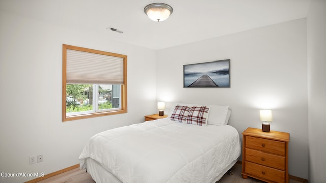 bedroom featuring wood-type flooring