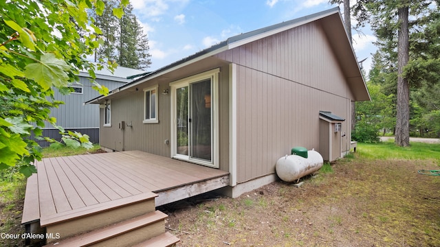 rear view of house featuring a deck