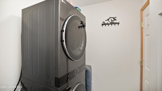 laundry room with stacked washer and dryer