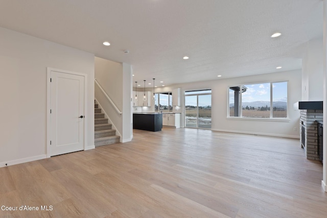 unfurnished living room with light wood-type flooring