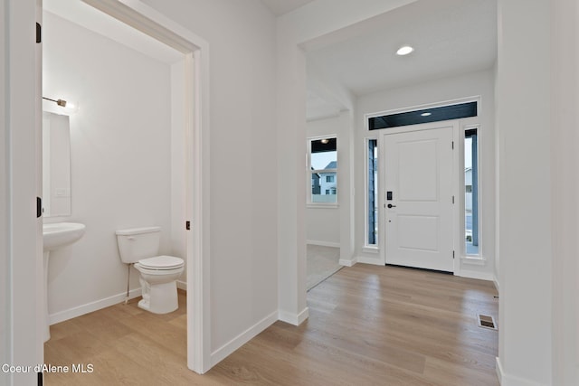 entryway with light hardwood / wood-style flooring