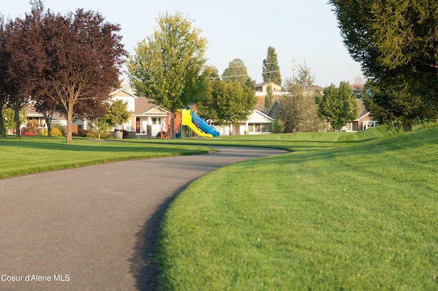 view of community with a playground and a lawn