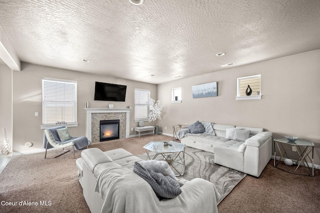 carpeted living room with a textured ceiling