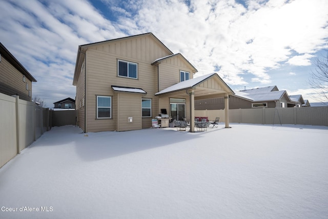 view of snow covered property