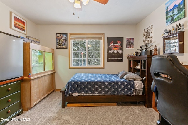 bedroom with ceiling fan and light colored carpet