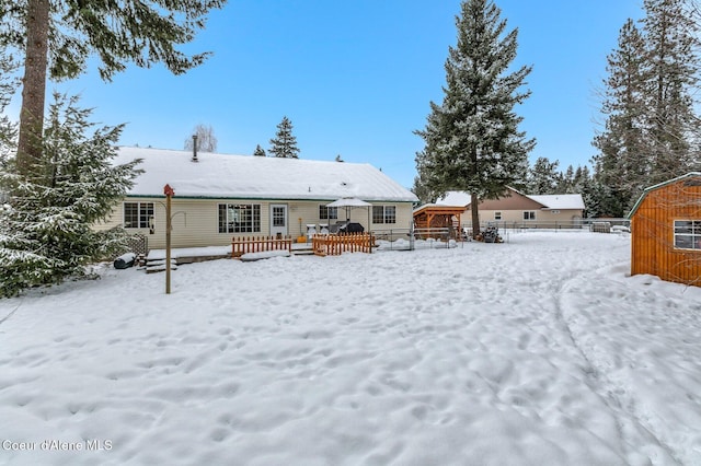 view of snow covered house