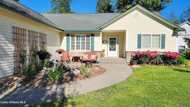 ranch-style house featuring a front yard