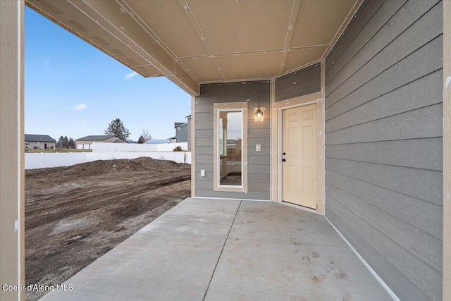 property entrance with a patio area