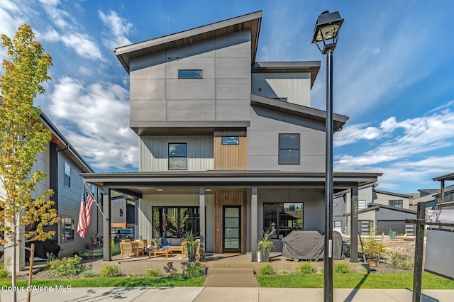 view of front of home with an outdoor hangout area