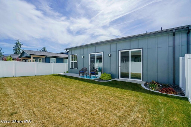 7257 Breaux Dr, Coeur Dalene, ID 83815 - rear view of house featuring board and batten siding and a patio