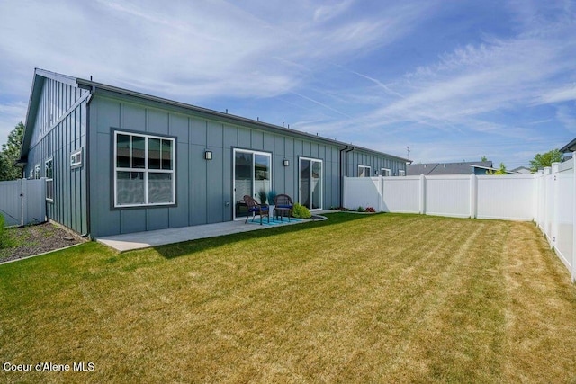 7257 Breaux Dr, Coeur Dalene, ID 83815 - rear view of property with board and batten siding and a patio area