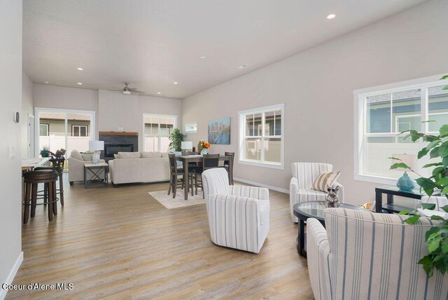 7257 Breaux Dr, Coeur Dalene, ID 83815 - living area with light wood finished floors, a ceiling fan, a fireplace, recessed lighting, and baseboards