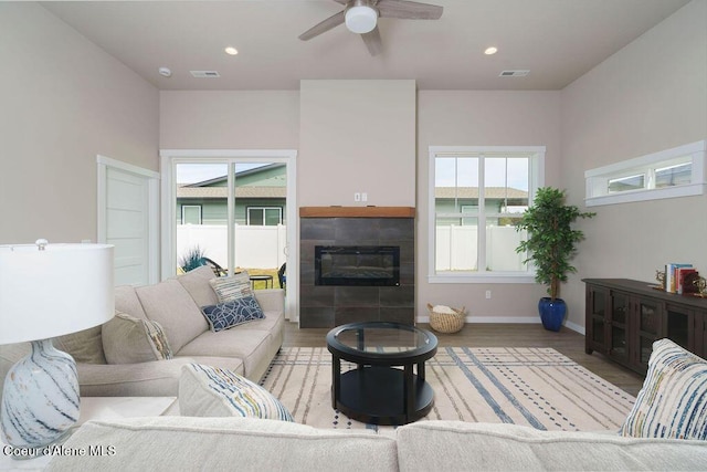 7257 Breaux Dr, Coeur Dalene, ID 83815 - living area featuring light wood-type flooring, ceiling fan, a fireplace, baseboards, and recessed lighting