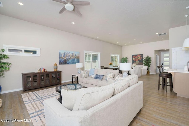 7257 Breaux Dr, Coeur Dalene, ID 83815 - living room featuring ceiling fan, light wood-style flooring, baseboards, and recessed lighting
