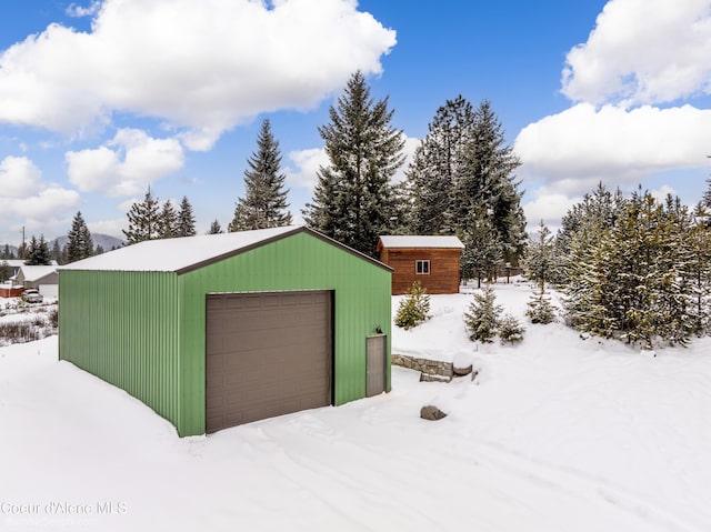 view of snow covered garage