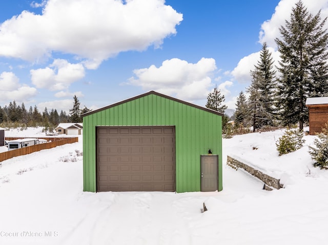 view of snow covered garage