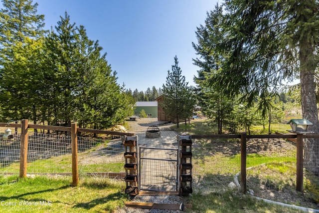 view of gate featuring fence