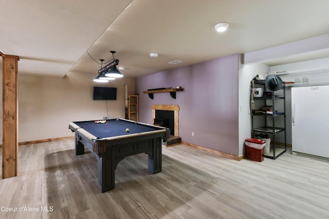 game room with hardwood / wood-style floors and pool table