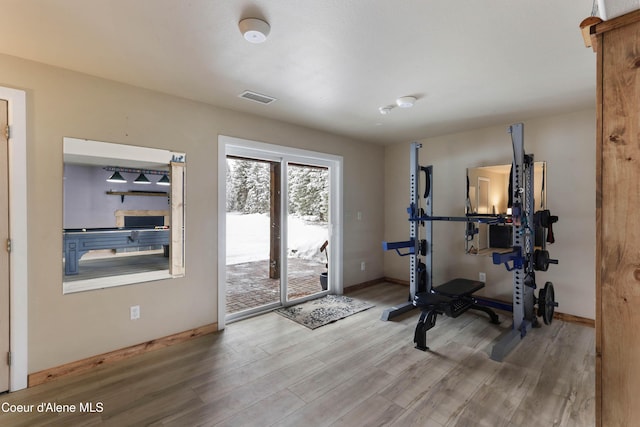 exercise area featuring wood-type flooring