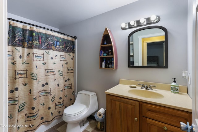 bathroom featuring vanity, a shower with shower curtain, and toilet