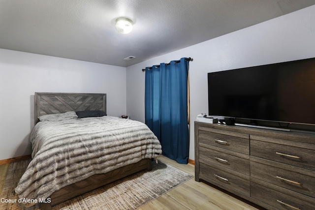 bedroom featuring light hardwood / wood-style flooring