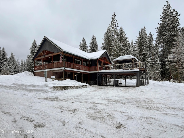 view of snow covered house