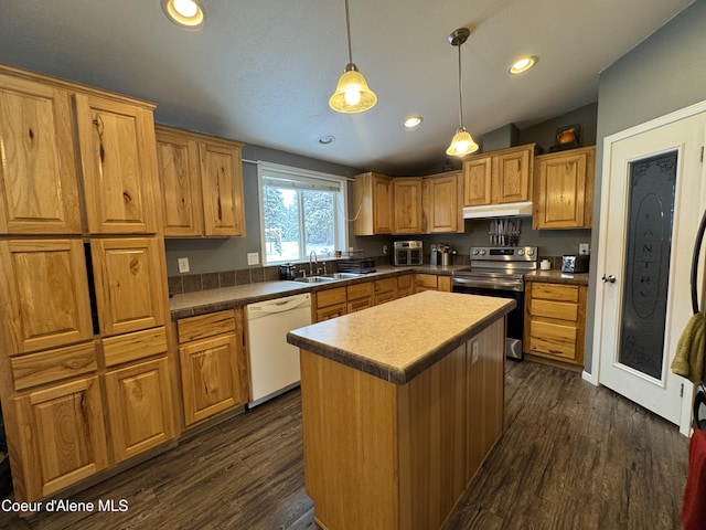 kitchen with dishwasher, sink, hanging light fixtures, a center island, and electric stove