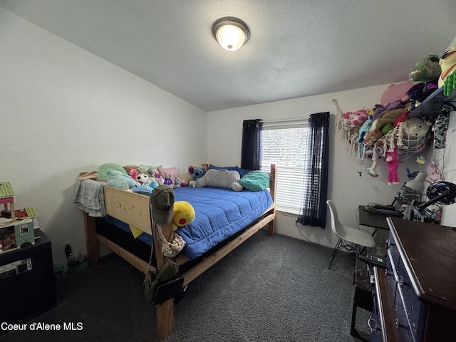 carpeted bedroom with a textured ceiling