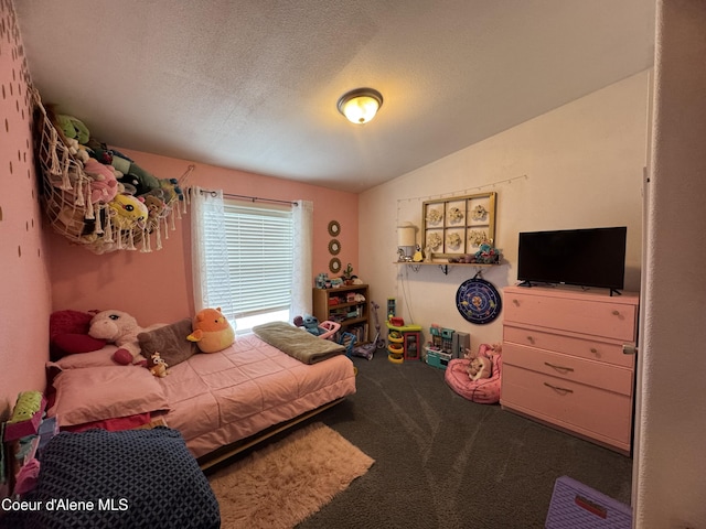 carpeted bedroom featuring vaulted ceiling and a textured ceiling