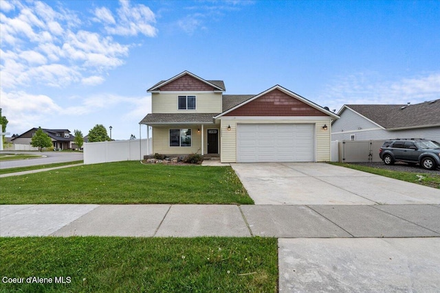 13043 N Zodiac Loop, Rathdrum, ID 83858 - view of front facade featuring an attached garage and driveway