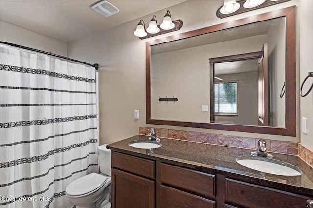 13043 N Zodiac Loop, Rathdrum, ID 83858 - full bathroom with toilet, double vanity, and curtained shower
