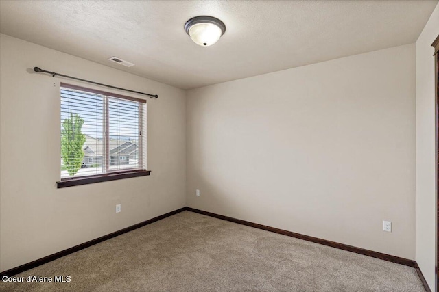 13043 N Zodiac Loop, Rathdrum, ID 83858 - spare room featuring carpet flooring and baseboards