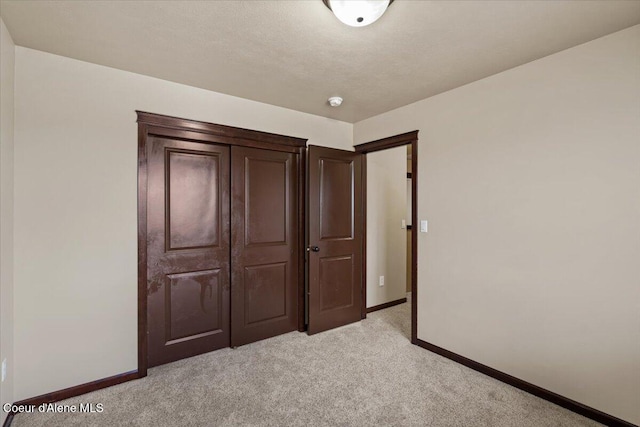 13043 N Zodiac Loop, Rathdrum, ID 83858 - unfurnished bedroom with light carpet and baseboards
