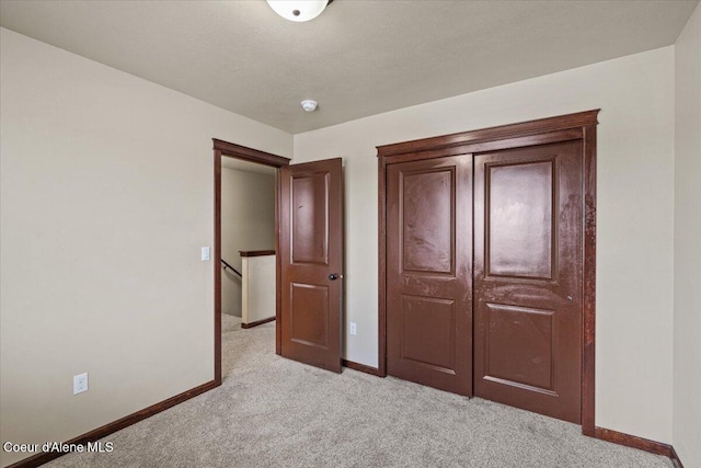 13043 N Zodiac Loop, Rathdrum, ID 83858 - unfurnished bedroom featuring light carpet and baseboards