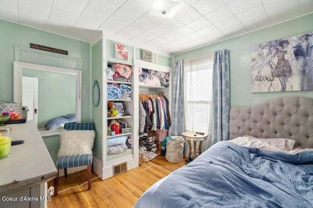 bedroom featuring hardwood / wood-style flooring and a closet