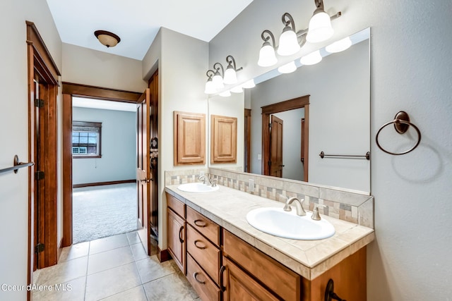 bathroom featuring vanity, decorative backsplash, and tile patterned floors